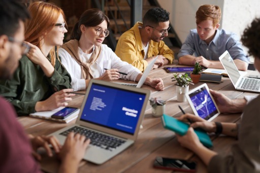 People sitting at a desk in a meeting