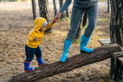 parent and child on a log