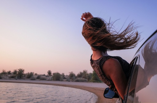 Girl hanging out the window