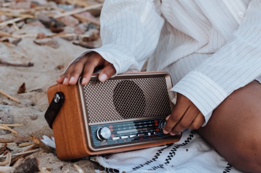 female hands holding a radio