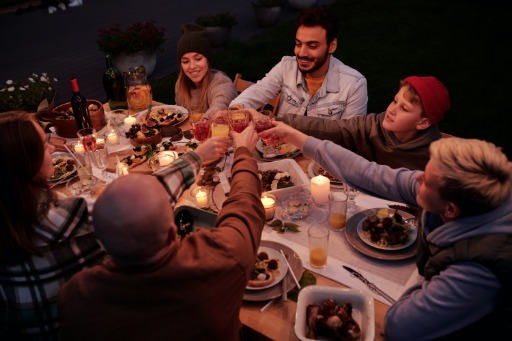 diverse friends toasing at a table