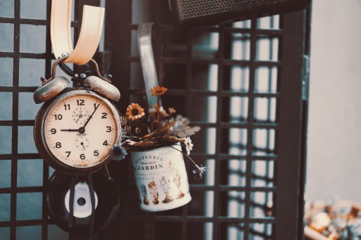 alarm clock dangling by a chain 