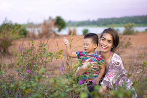 mother and kid in grass